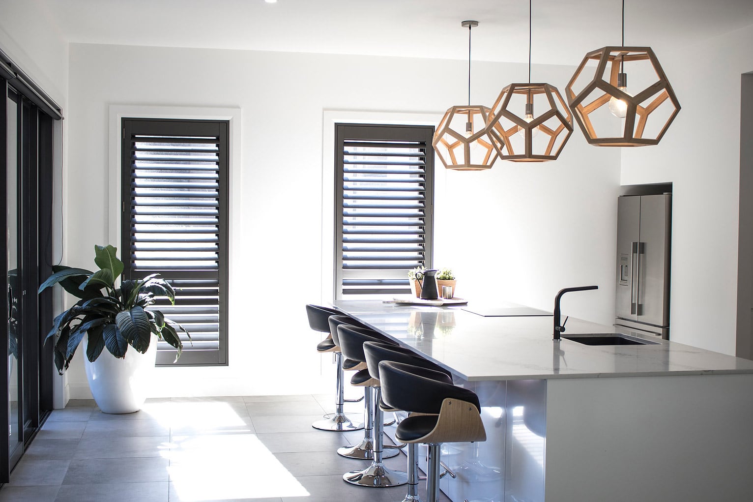 Energy-efficient shutters installed in a Canberra house for insulation benefits Energy-efficient shutters installed in a Canberra house for insulation benefits